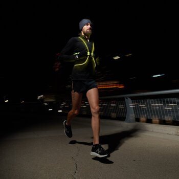 A man running in the dark with a Tracer360.